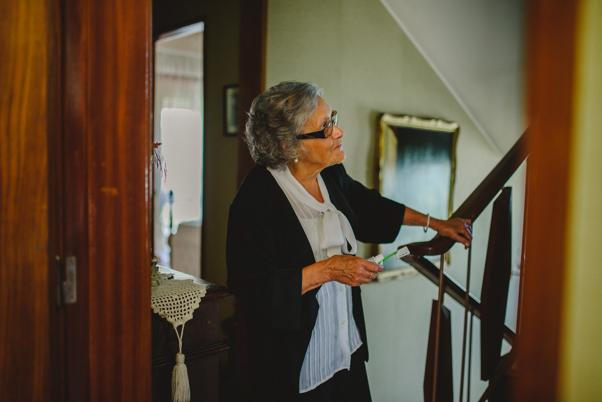 Grandma waiting for groom to come down to give him his toothbrush