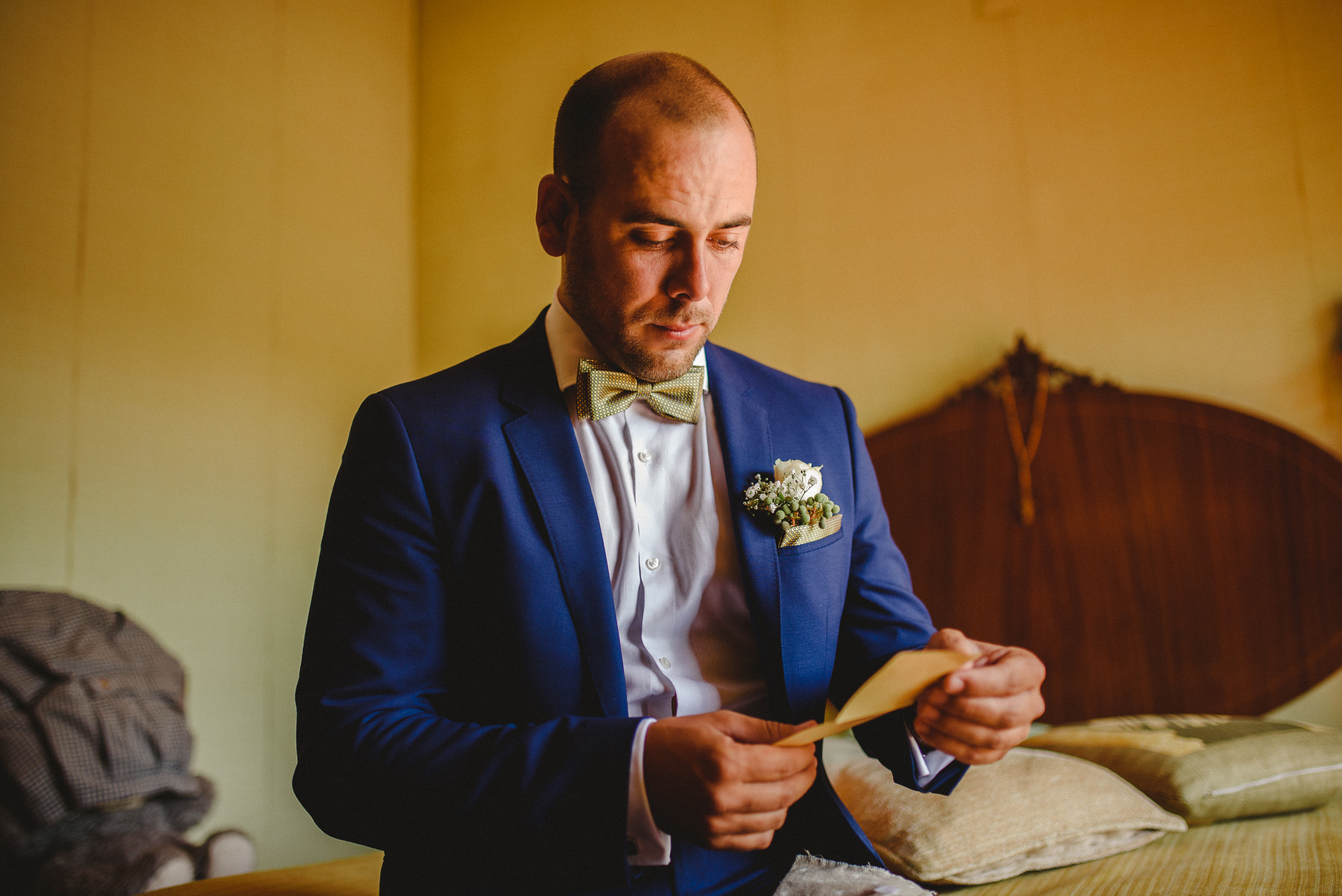 Groom reading a bride's letter