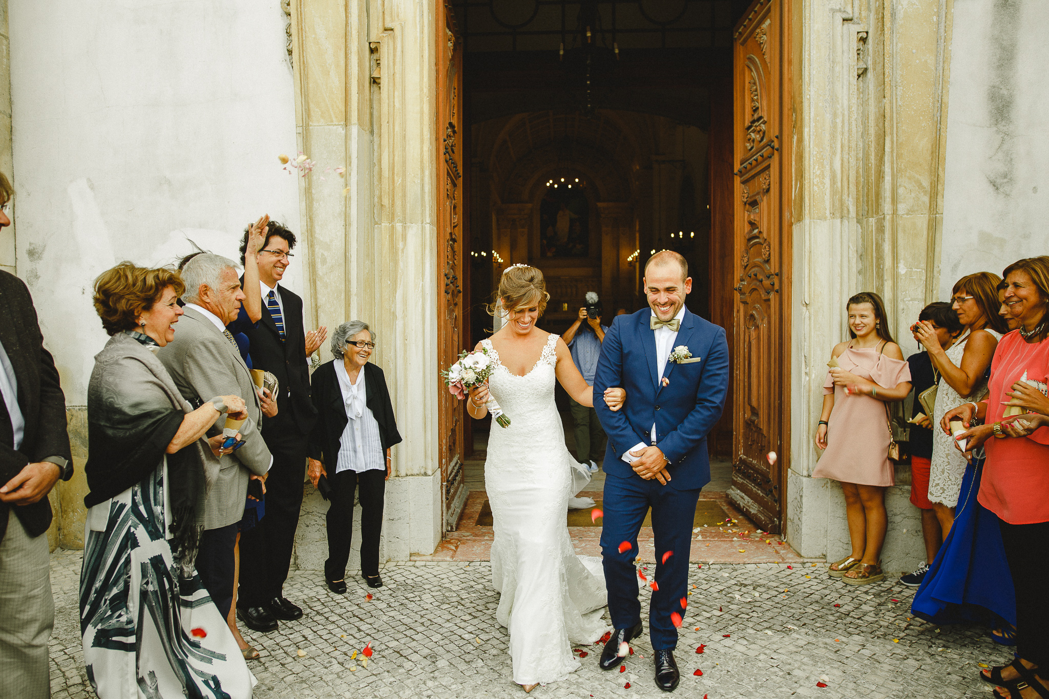 Bride and groom leaving church after ceremony