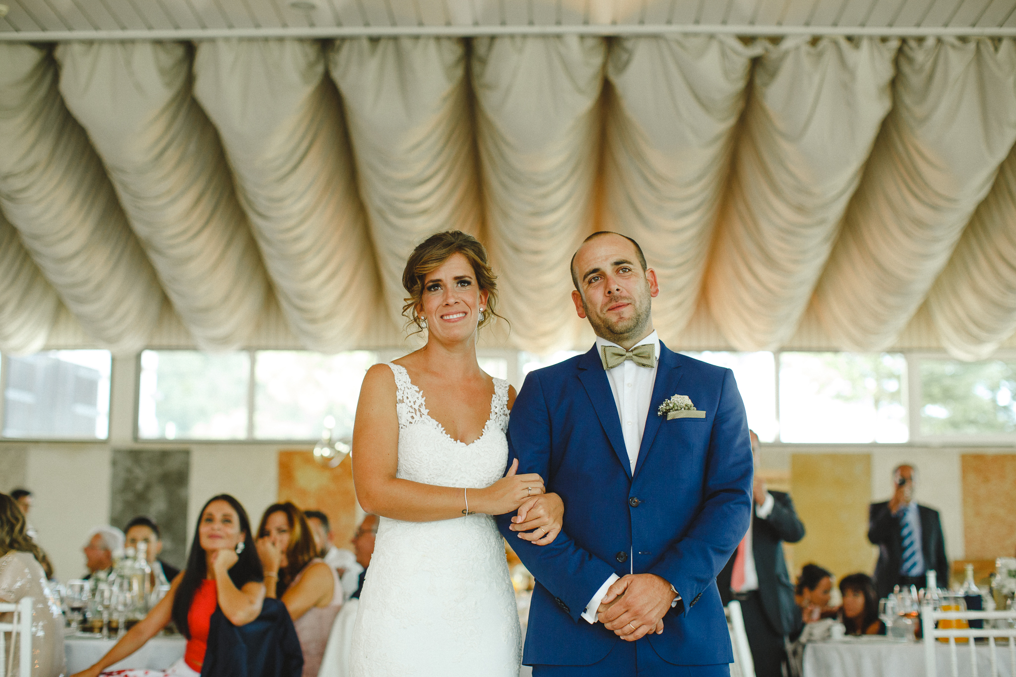 Bride and groom feeling emotional with groom's grandfather speech.