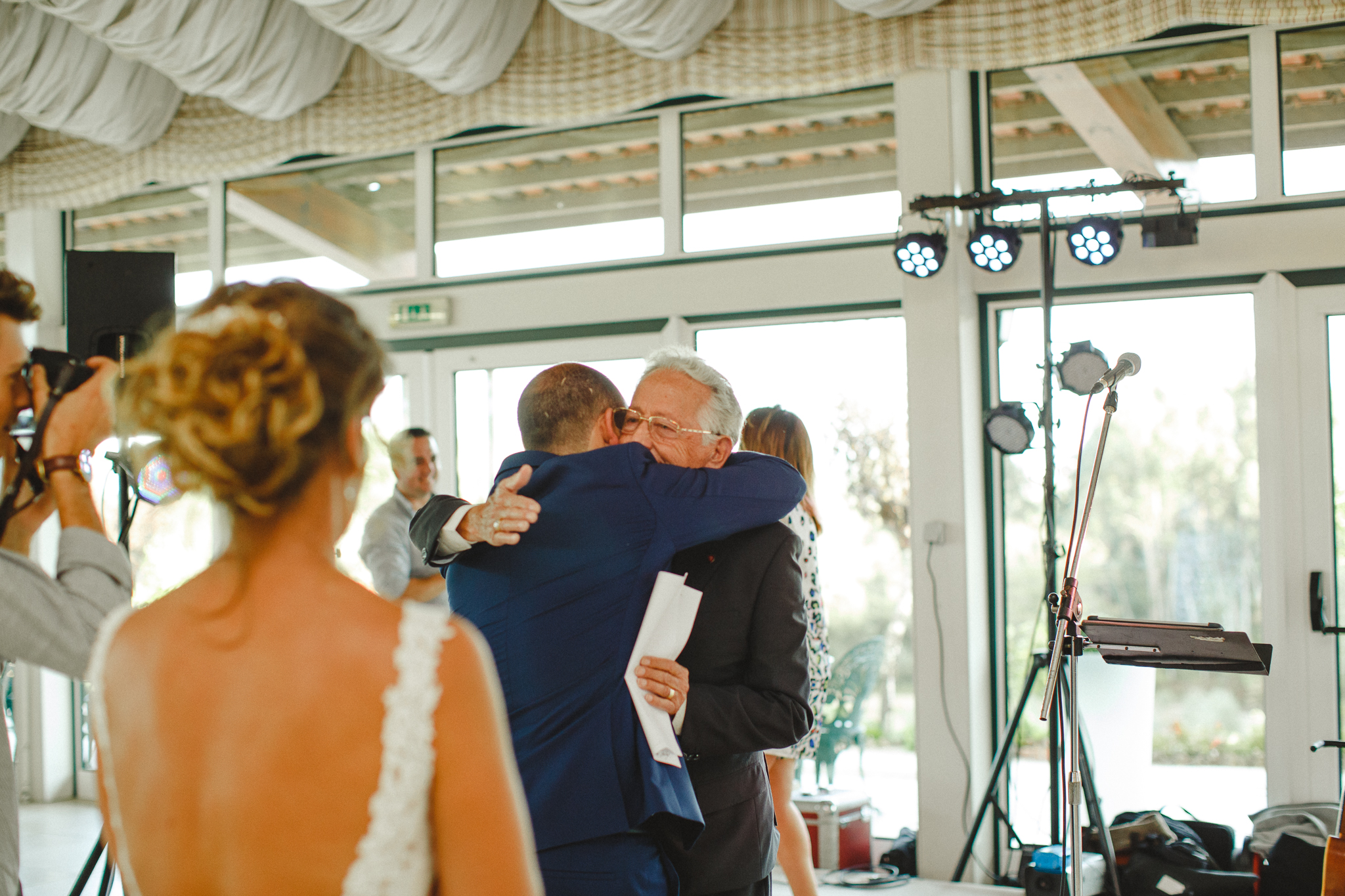 Groom hugging his grandfather after his speech.