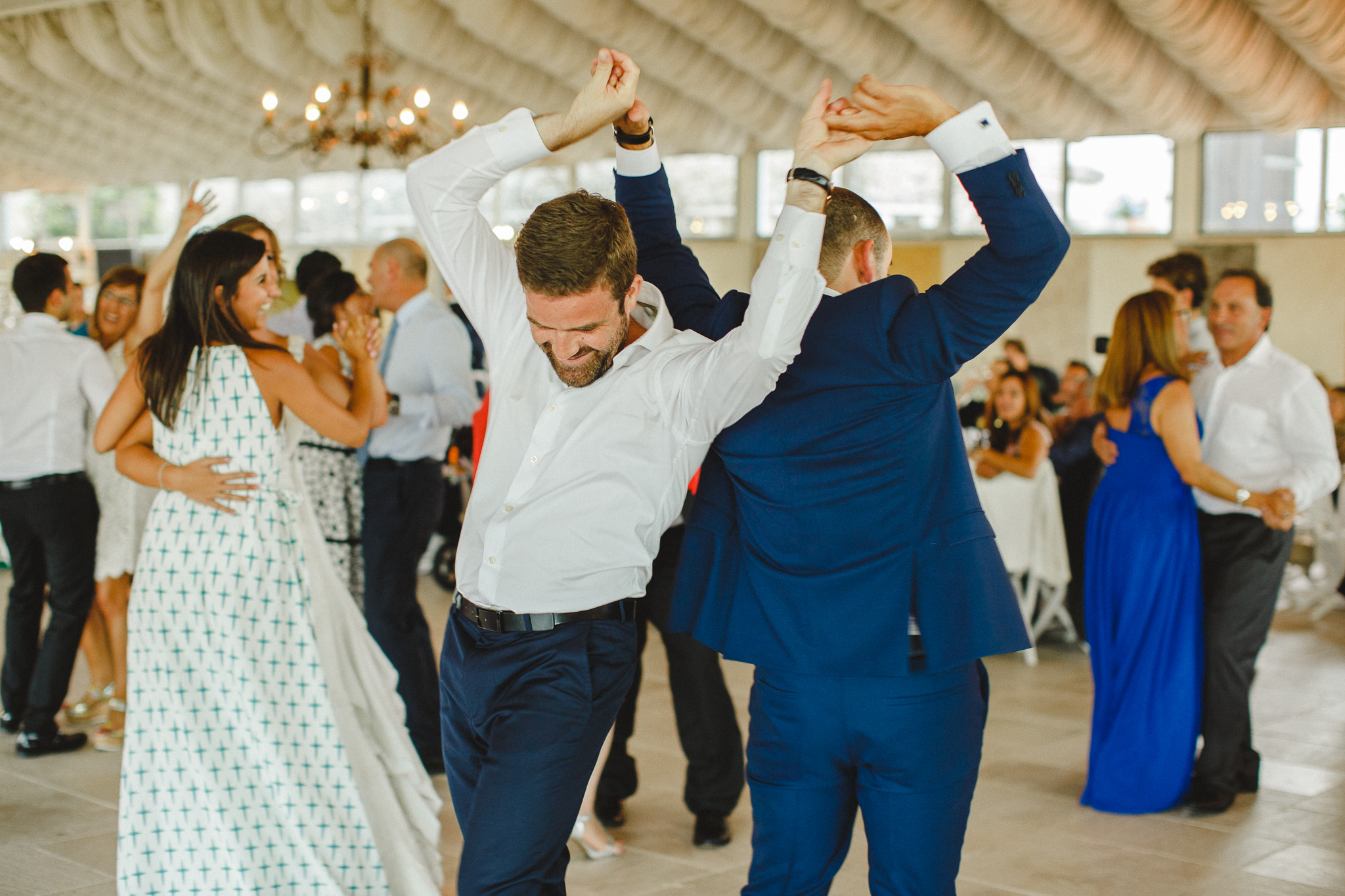 Wedding guests having fun on the dance floor.