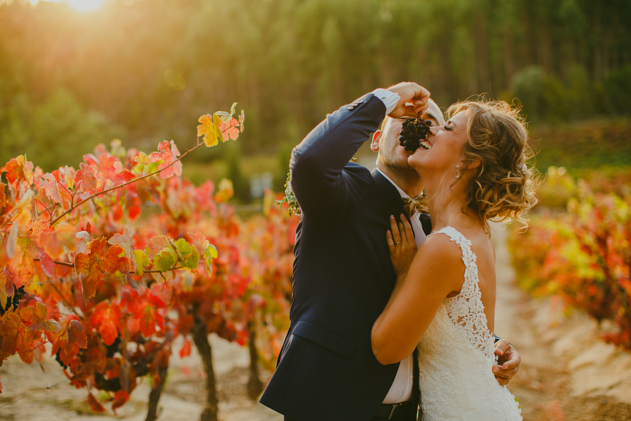 Bride and groom during their bridal photo shoot during sunset in the vineyards.