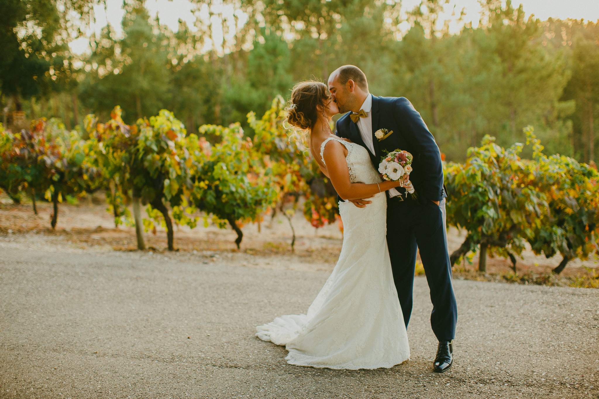 Groom holding bride by her waist and giving her a passionate speech.