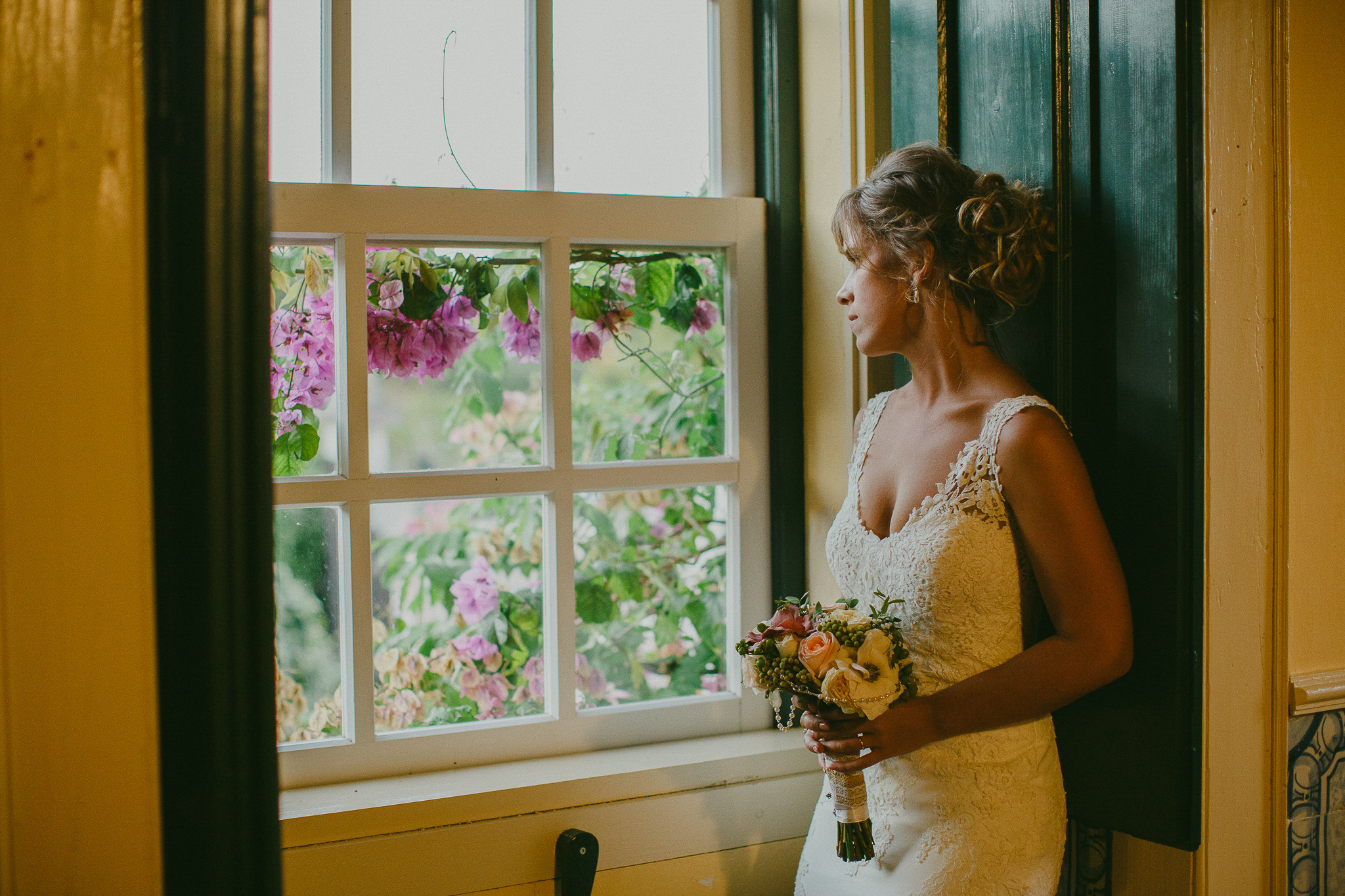 Bride at the window looking outside