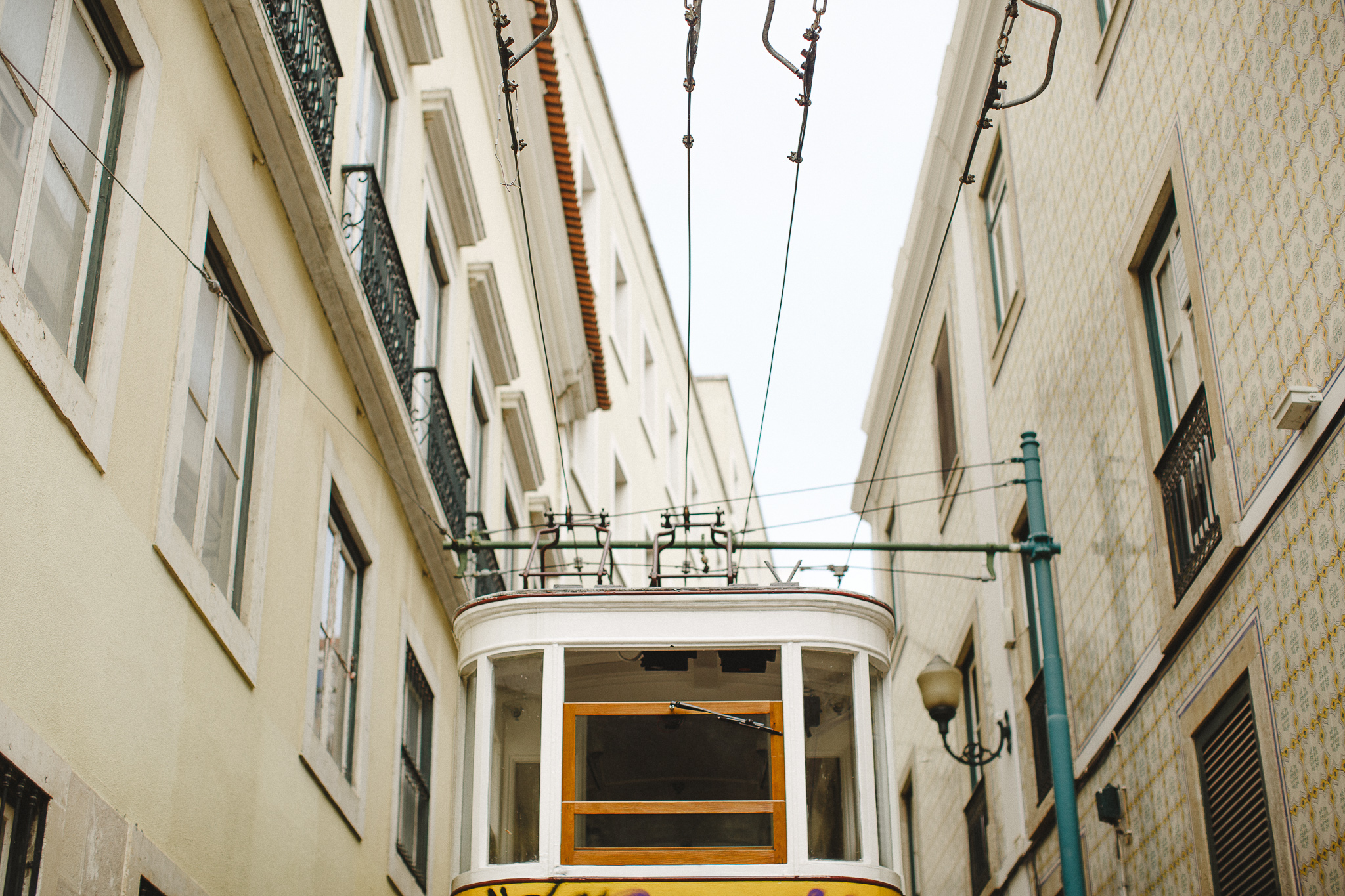 Lisbon's yellow tram in one iconic street.