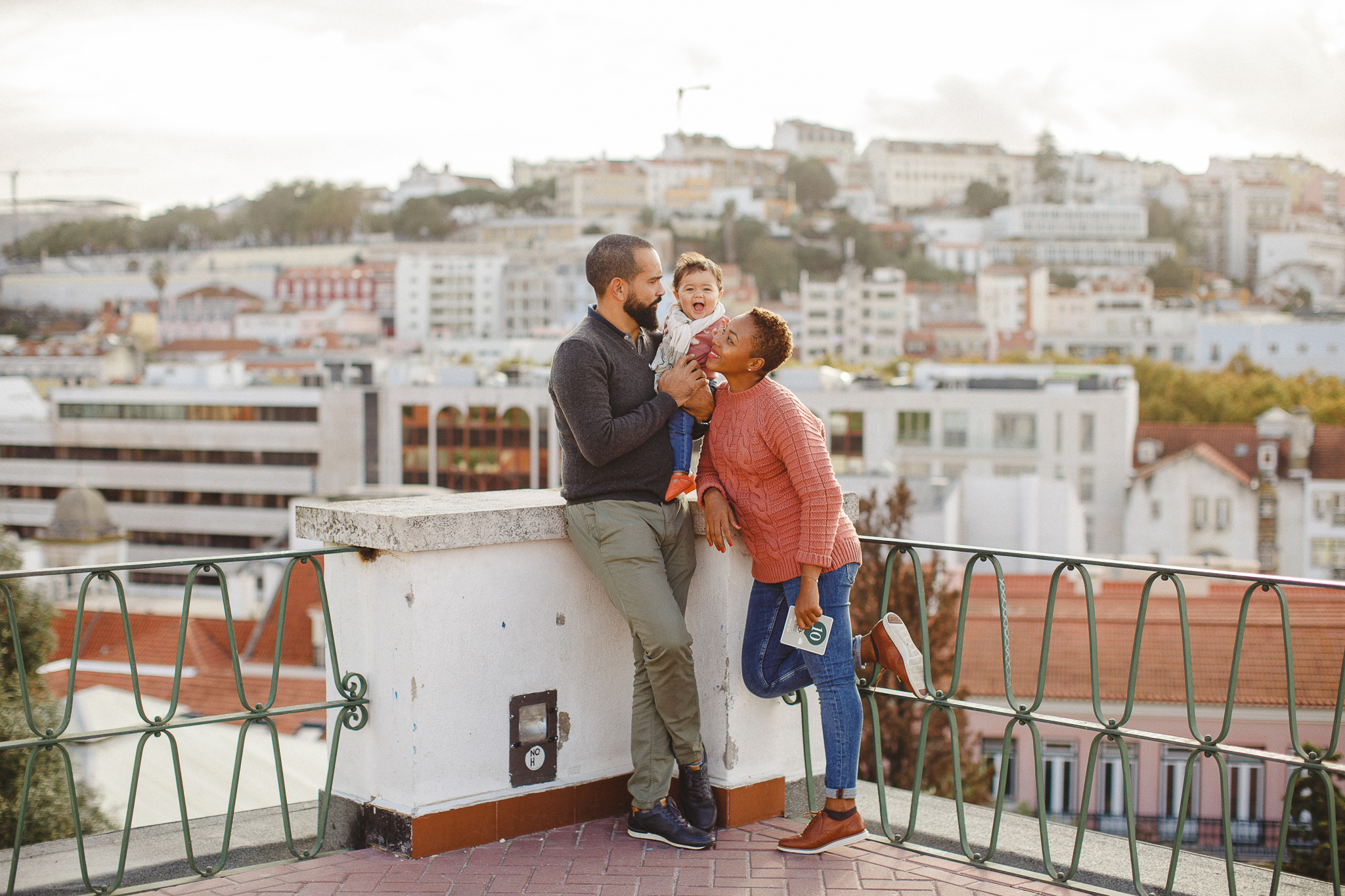 Family smiling during their family photo shoot in Lisbon with Hello Twiggs. 