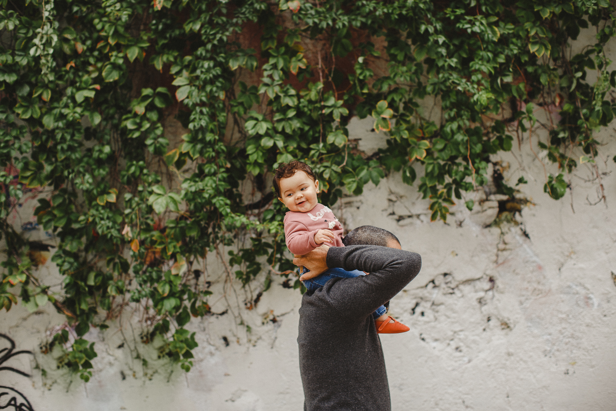 Baby on a piggyback ride with her dad.