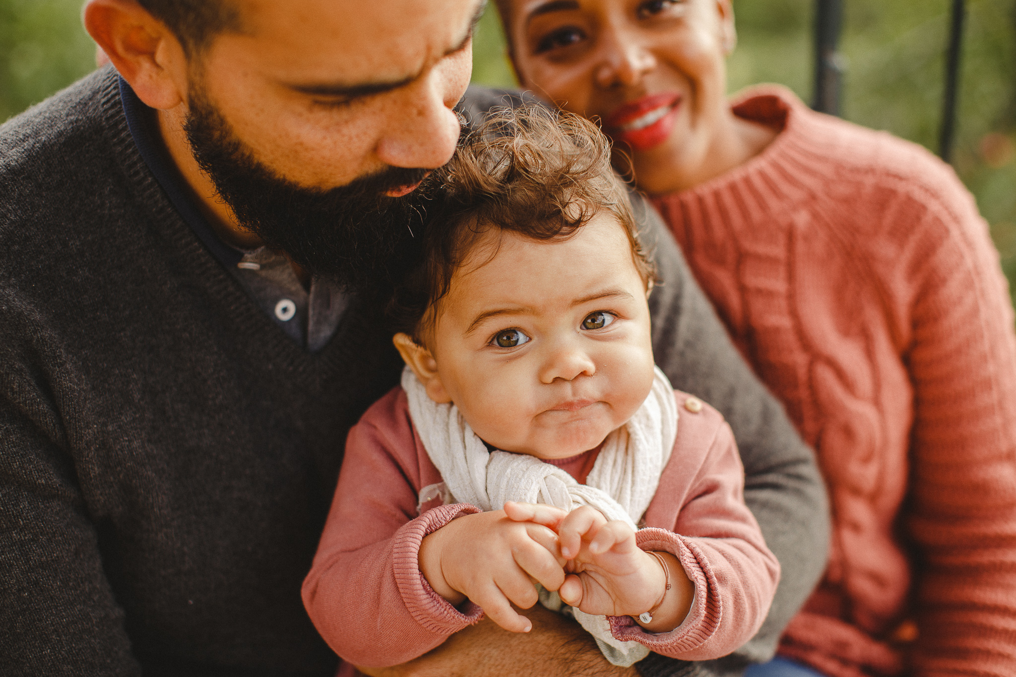 Baby on her dad's lap during a family photo shoot in Lisbon, by Hello Twiggs.